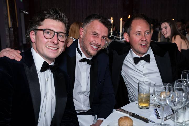 Three of the team at dinner