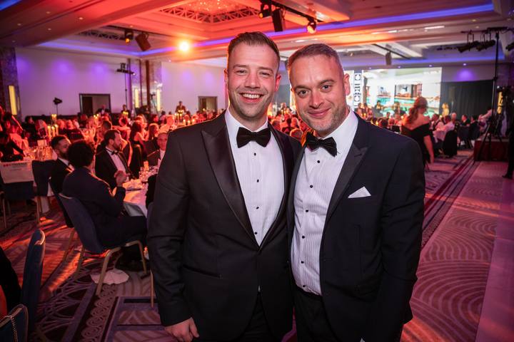Two of the team in the ballroom