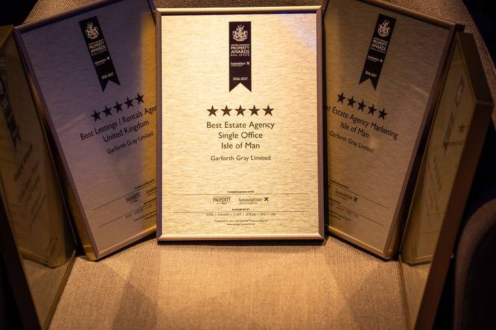 Three of the award plaques standing together