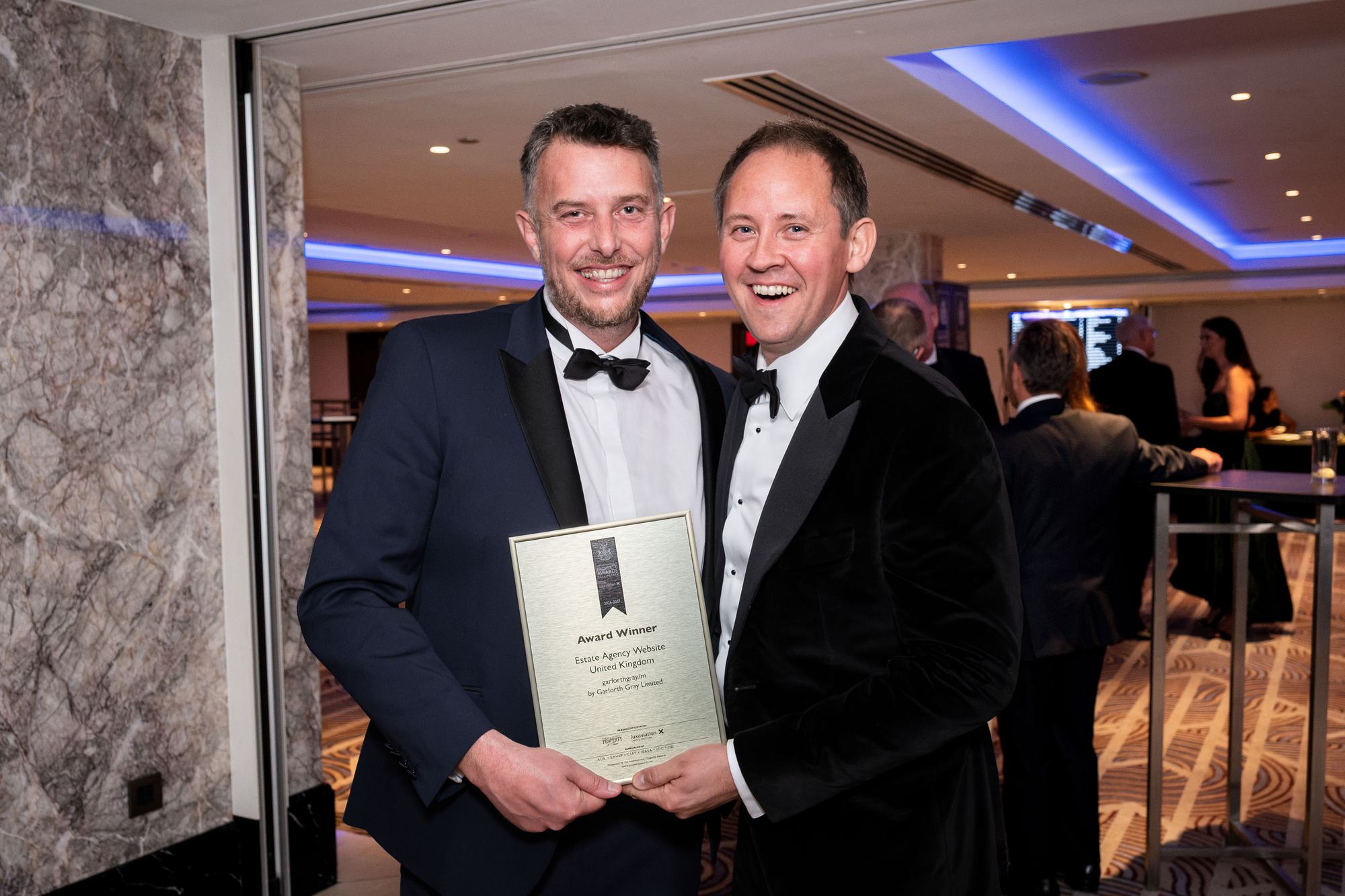 Andy and Jonny holding the Estate Agency Website, United Kingdom award plaque